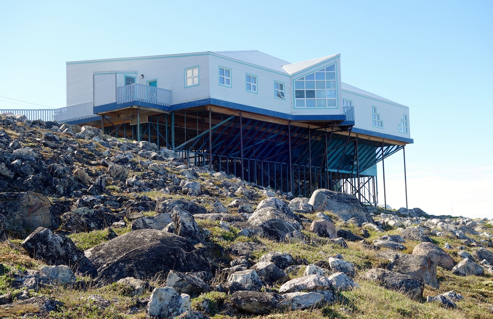 The Pond Inlet Nattinak Visitor Center and Library is built on stilts due to permafrost conditions.