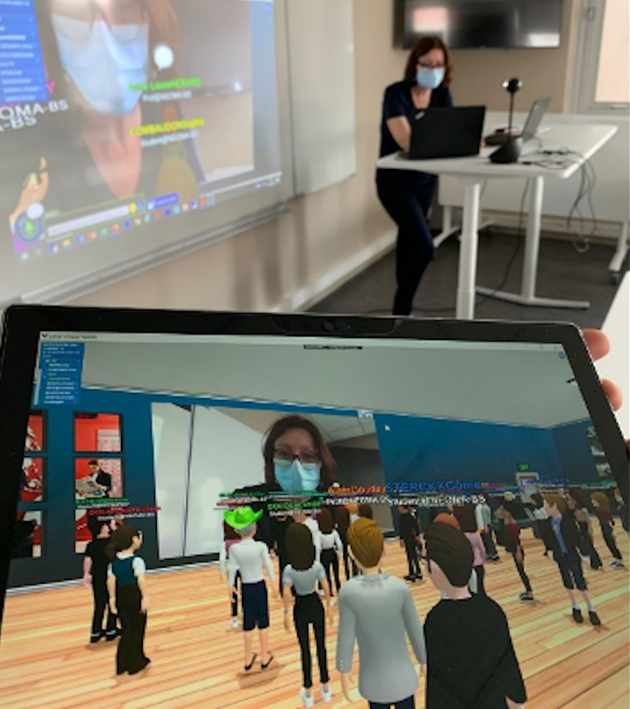 A laptop screen that shows a professor lecturing in real life but shows the same professor lecturing within a virtual environment