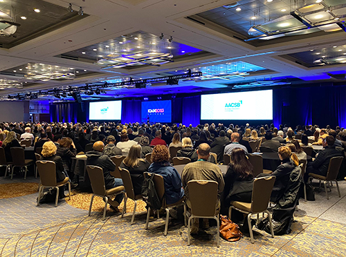 Photo of filled room at ICAM 2023 session on the Value Proposition of Business Schools