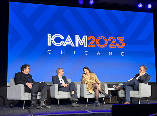 Photo of AACSB's ICAM 2023 session on "Fixing the Research Culture," with four panelists on stage
