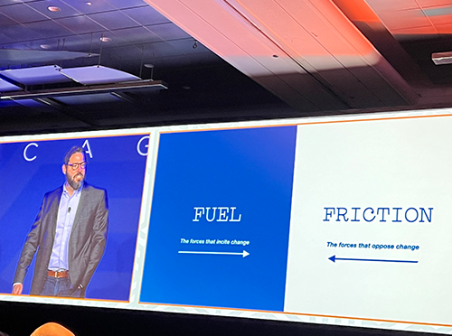 Photo of keynote presentation by David Schonthal on "Overcoming the Resistance That Awaits New Ideas," with presentation screen reading Fuel on one side and Friction on the other